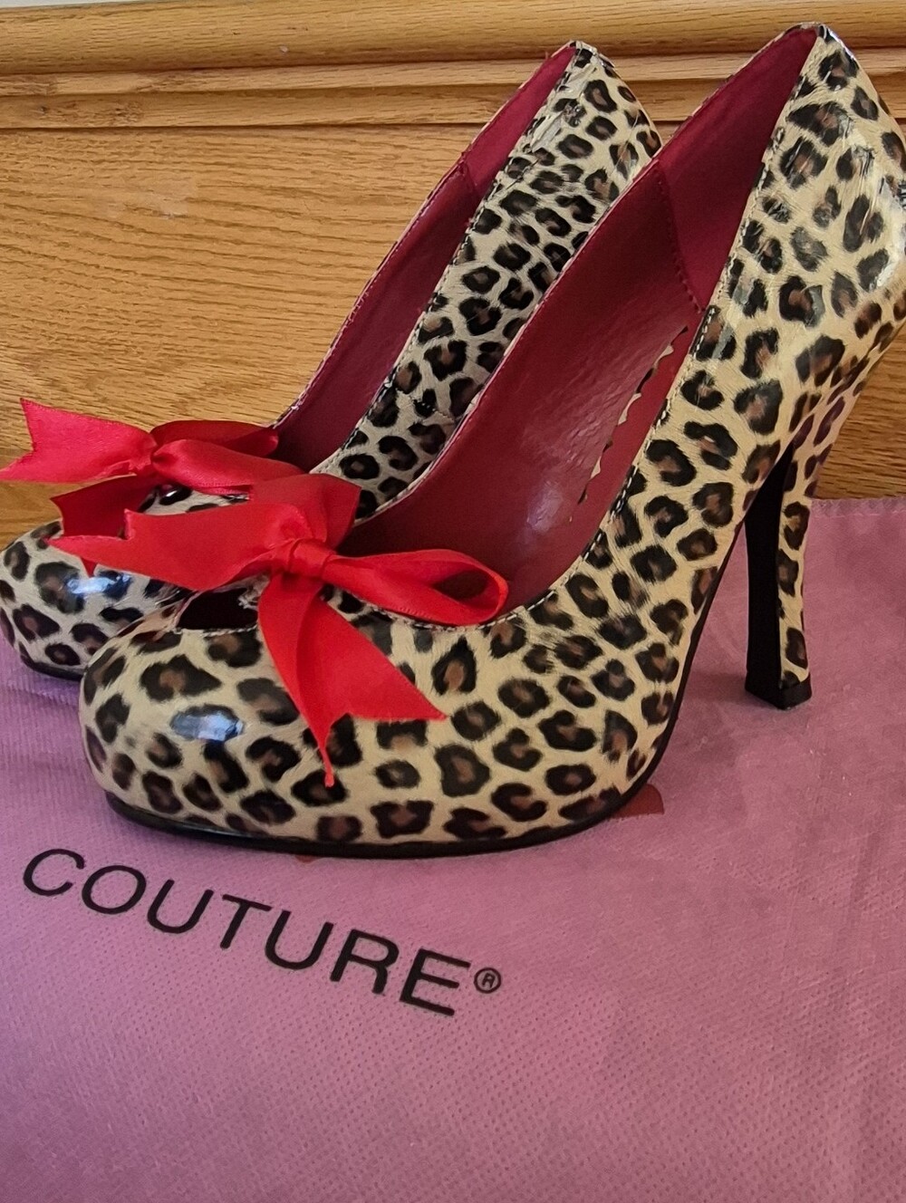 Pinup Couture Leopard Print High Heel Pumps with Red Bow
